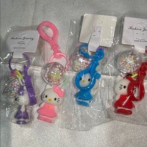 Hello Kitty bag charms set of 6 purple, pink, blue and red